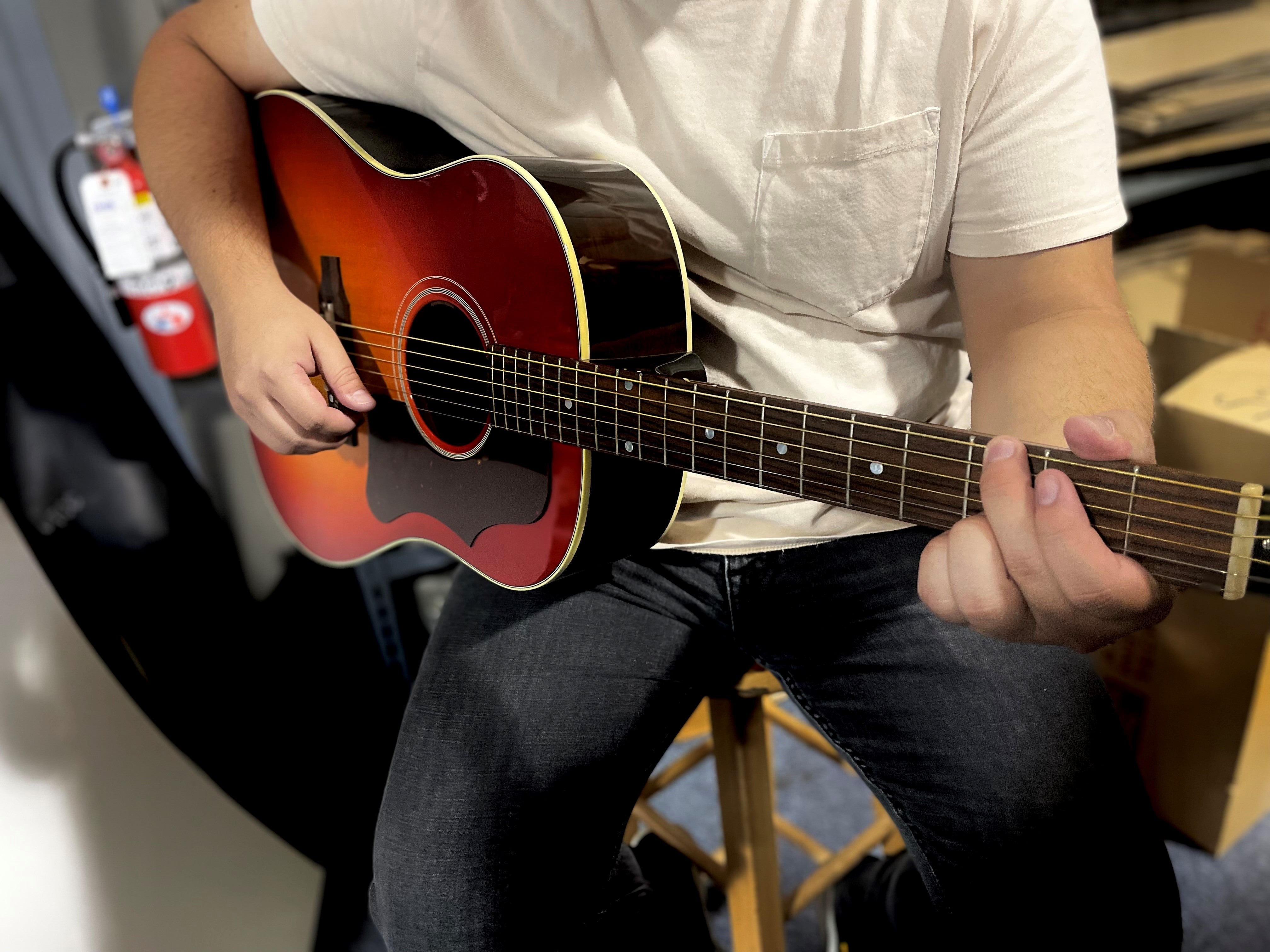 guy playing acoustic guitar