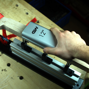 person using the 12" Aluminum radius sanding block