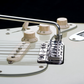 chrome close up view of Vegatrem 2-Point bridge on white guitar