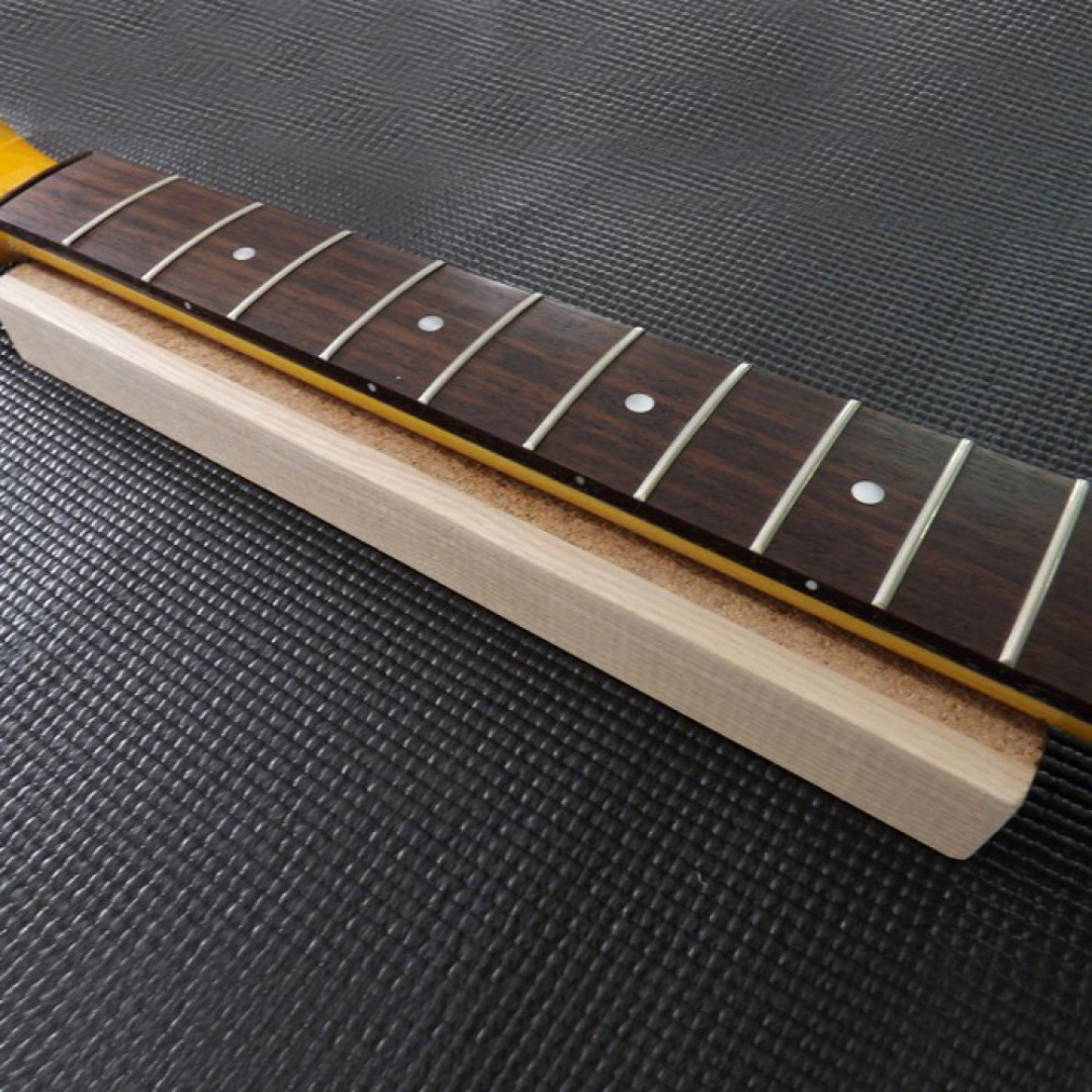 Guitar neck support caul in use