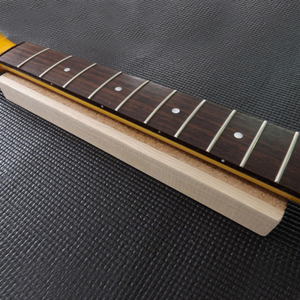 Guitar neck support caul in use