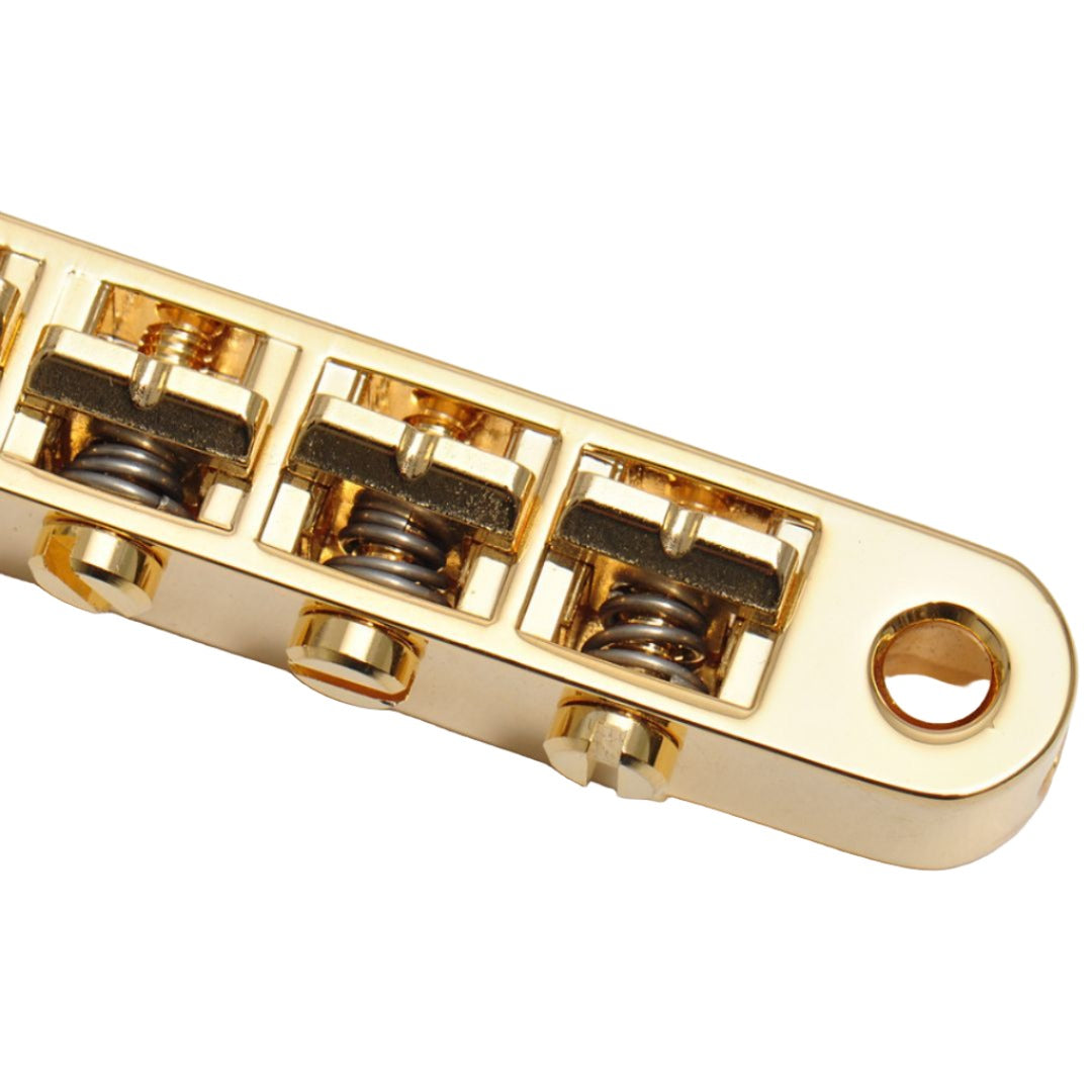 guitar bridge top close up view gold