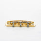 halon offset US-spec bridge back view gold