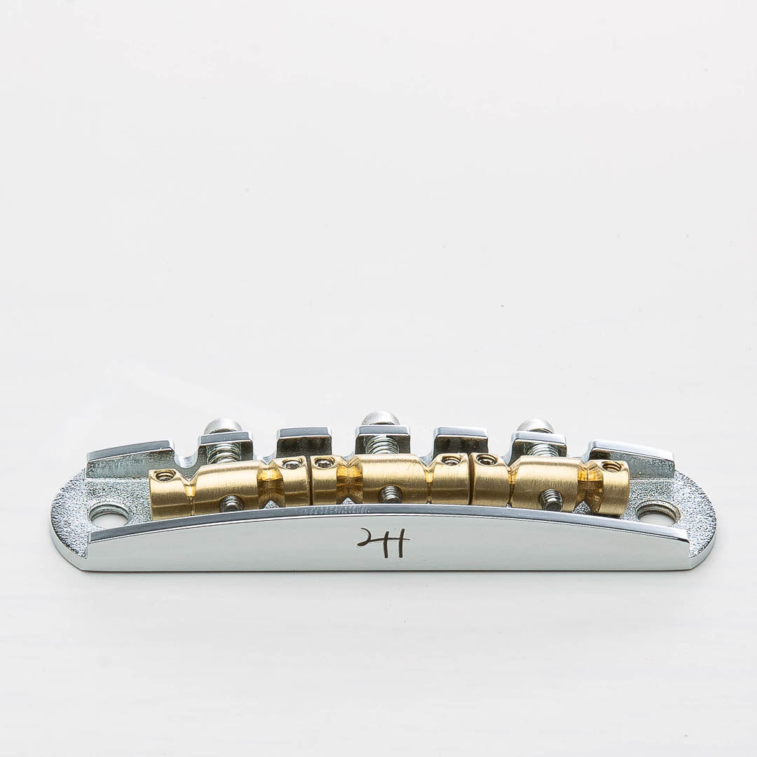 halon metric offset bridge w/ brass saddles front view chrome