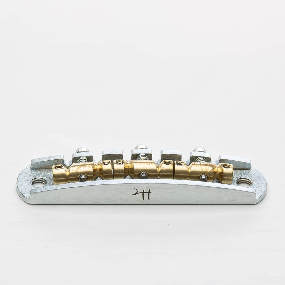 halon metric offset bridge w/ brass saddles front view satin chrome