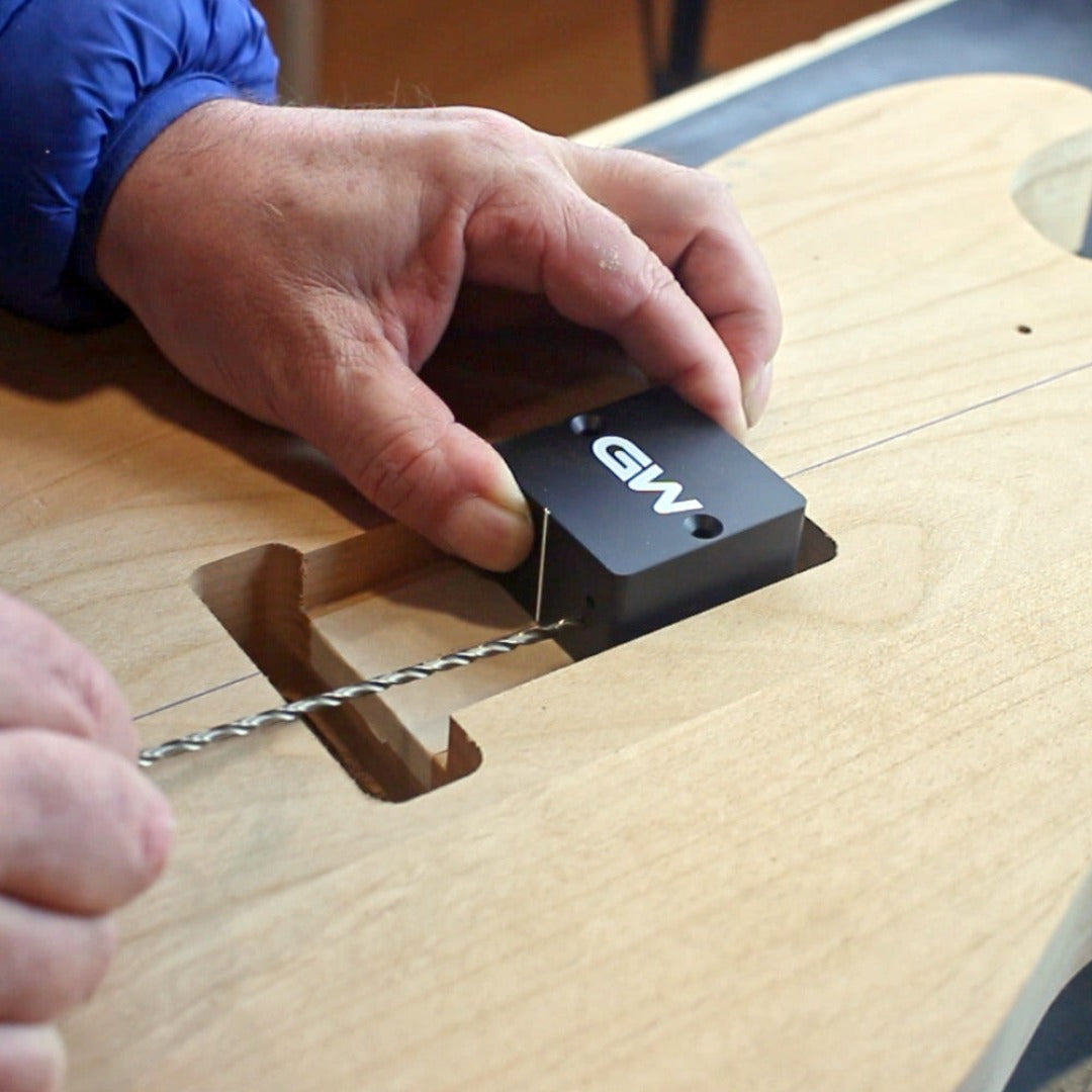 trem claw drilling jig in use on guitar view