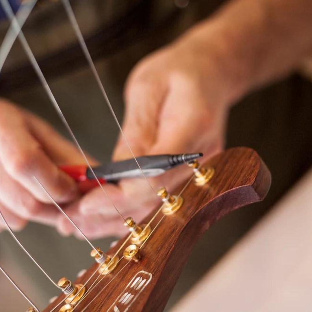 Multi-Purpose Pliers close up being used on guitar string