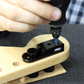 Tuner Pin Locator Jig with person screwing in the screws