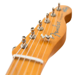 up close headstock of guitar at an angle